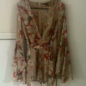 Floral romper. Size medium. Never worn before.